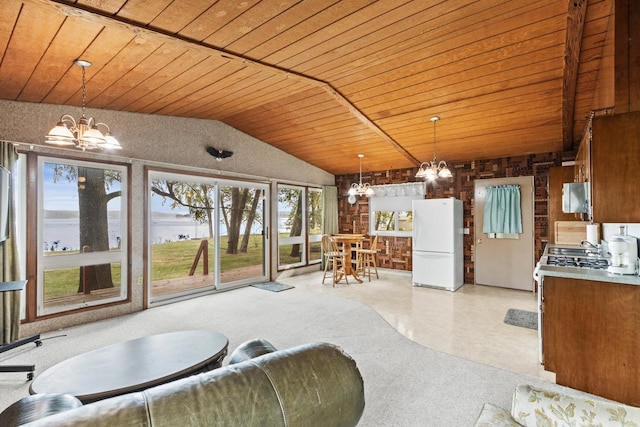 carpeted living room with wooden ceiling, a wealth of natural light, a water view, and vaulted ceiling