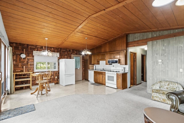 W11384 Bay Dr, Lodi, WI 53555 - kitchen featuring white appliances, wood ceiling, open floor plan, light countertops, and wooden walls
