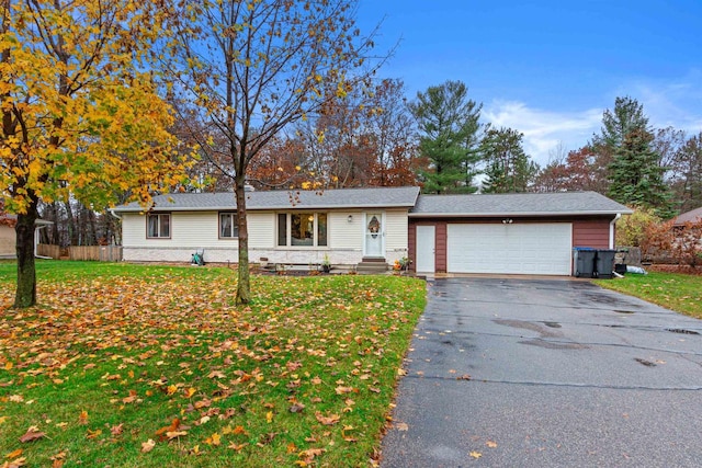 single story home with a garage and a front yard