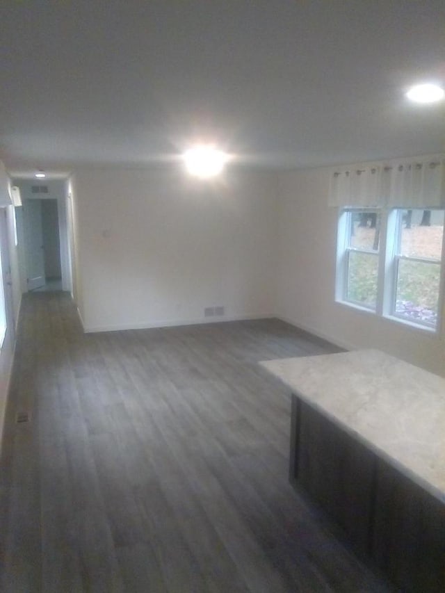 spare room featuring dark hardwood / wood-style floors