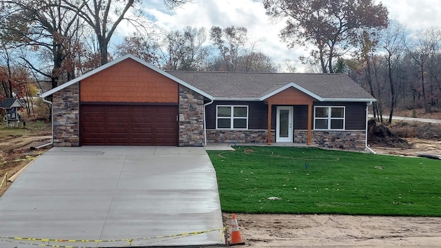 ranch-style house with a garage and a front lawn