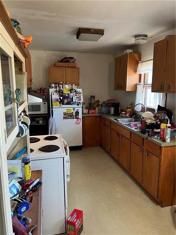 kitchen with sink and white appliances