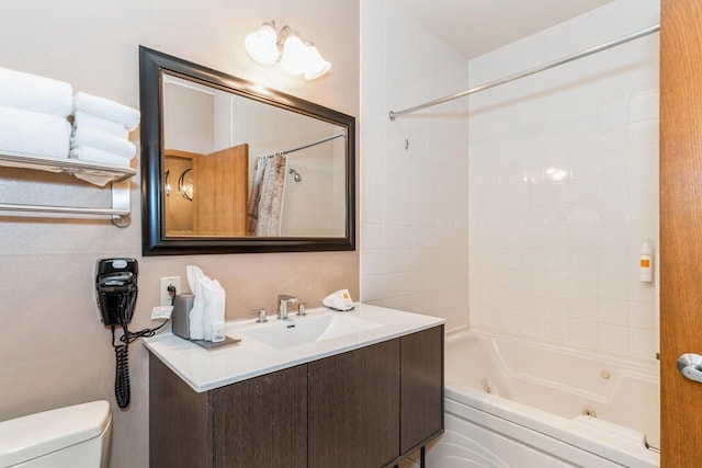 full bathroom with vanity, shower / bath combo with shower curtain, and toilet