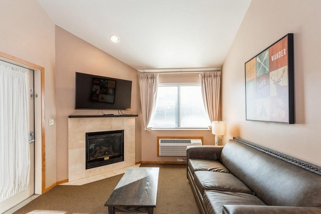 7020 Grand Geneva Way Unit 159, Lake Geneva, WI 53147 - carpeted living area featuring vaulted ceiling, a fireplace, a wall unit AC, baseboards, and recessed lighting