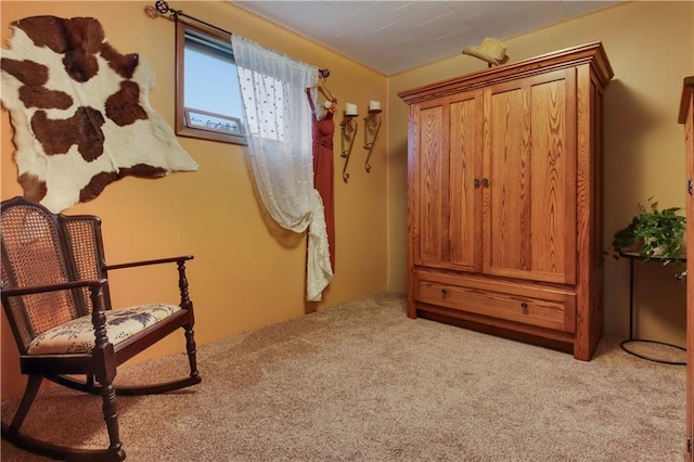 living area featuring light carpet