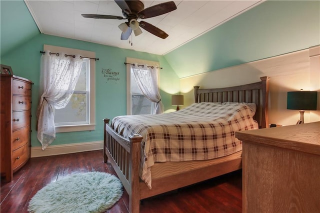 bedroom featuring dark wood-type flooring, lofted ceiling, and ceiling fan