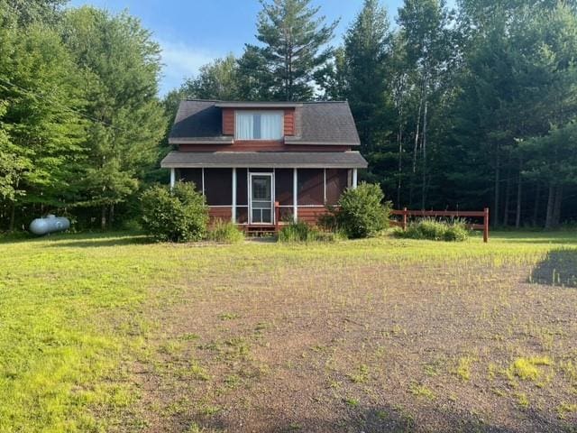 back of property featuring a sunroom