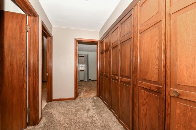 corridor with light colored carpet