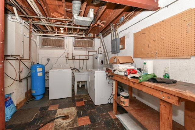 washroom featuring washing machine and dryer, electric panel, and electric water heater