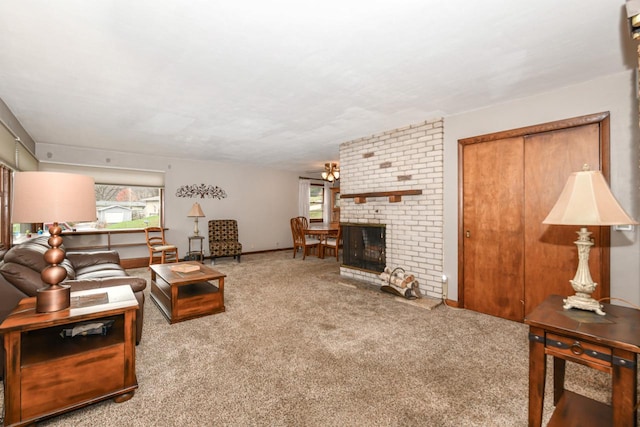 living room with carpet floors and a fireplace