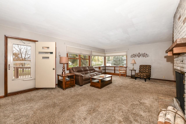 carpeted living room featuring a wealth of natural light and a fireplace