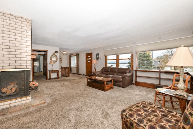 carpeted living room with a fireplace