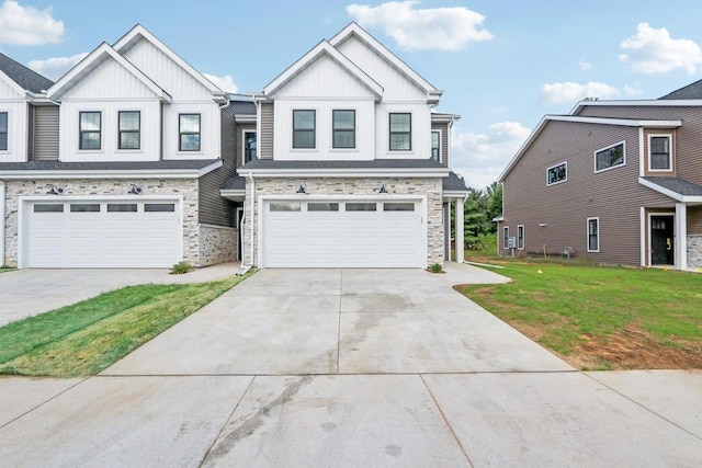 view of front of property featuring a garage and a front lawn