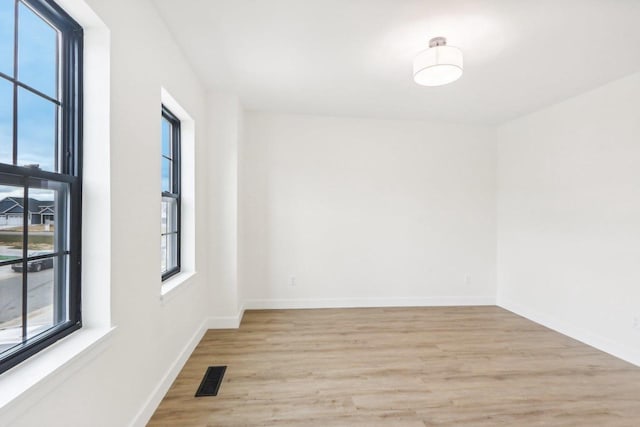 empty room with light wood-type flooring