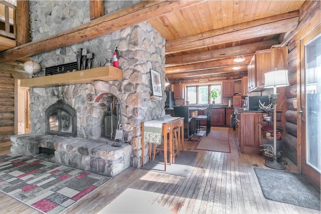 living room featuring a stone fireplace, dark hardwood / wood-style flooring, beamed ceiling, and wooden ceiling