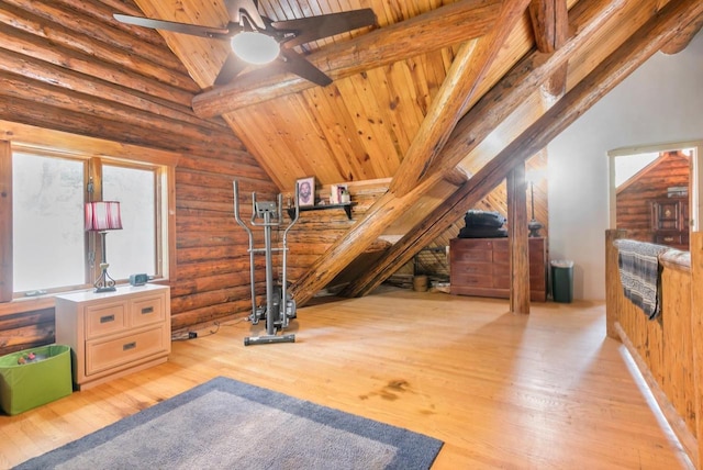 interior space featuring high vaulted ceiling, light hardwood / wood-style flooring, ceiling fan, and beam ceiling