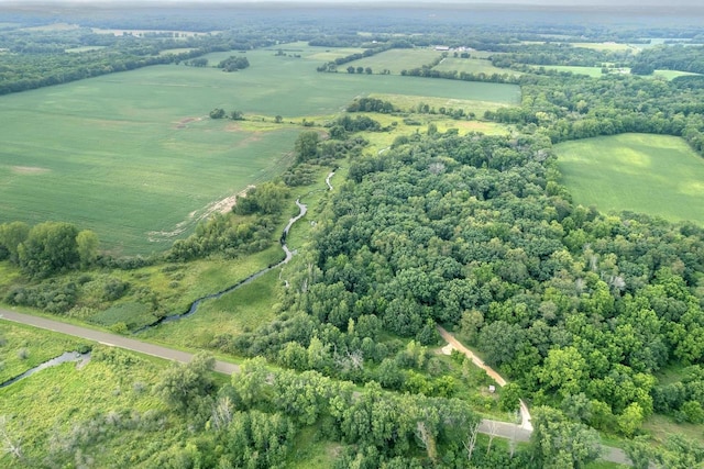 birds eye view of property with a rural view