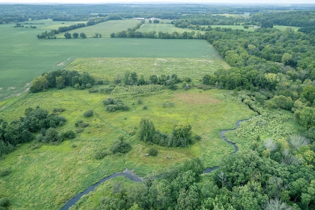 birds eye view of property with a rural view