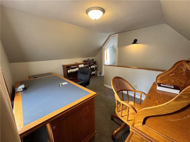 playroom featuring a textured ceiling, lofted ceiling, and dark carpet