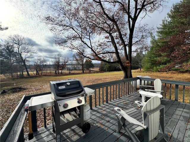 wooden deck featuring area for grilling