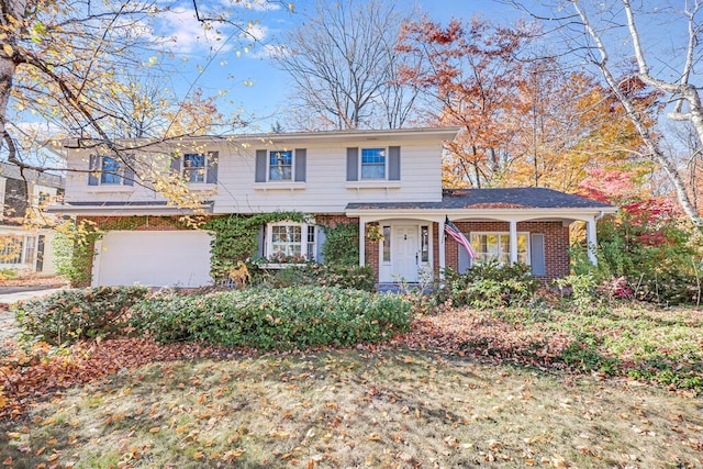 front of property featuring a porch and a garage