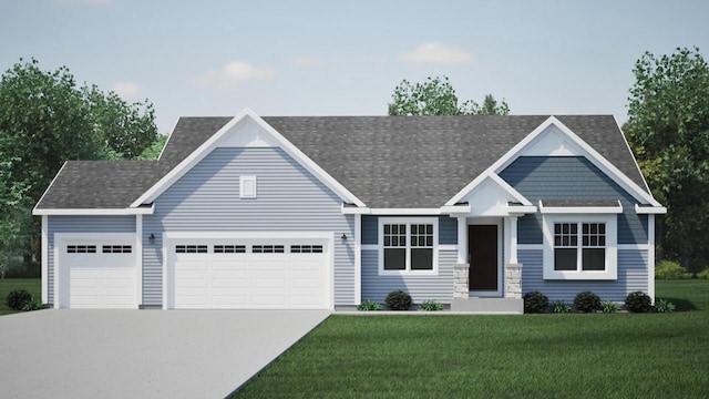 view of front of home with a garage and a front lawn