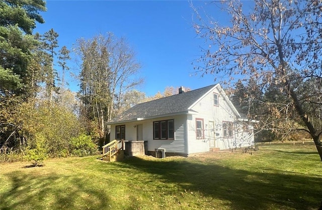 6970 Second St, Loretta, WI 54896 - view of property exterior with a yard and a chimney