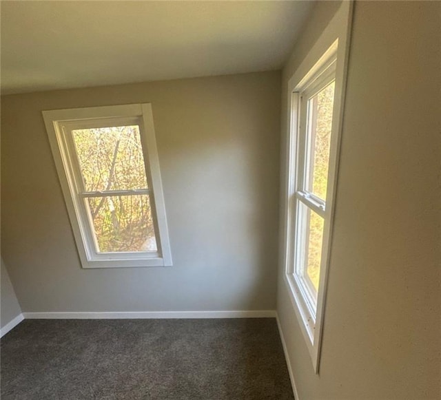 6970 Second St, Loretta, WI 54896 - empty room with dark colored carpet and baseboards