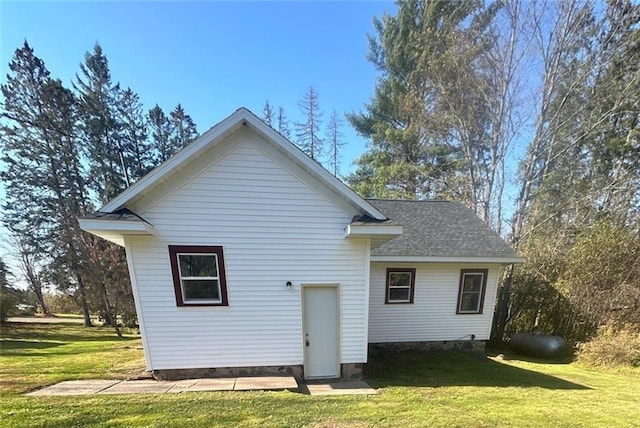 6970 Second St, Loretta, WI 54896 - rear view of house featuring a lawn, a shingled roof, and crawl space