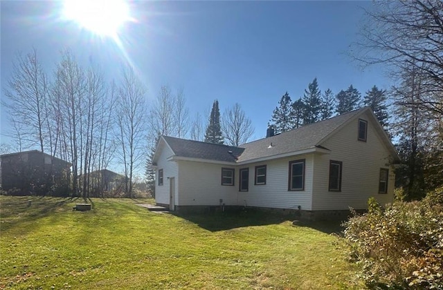 6970 Second St, Loretta, WI 54896 - back of house featuring a yard