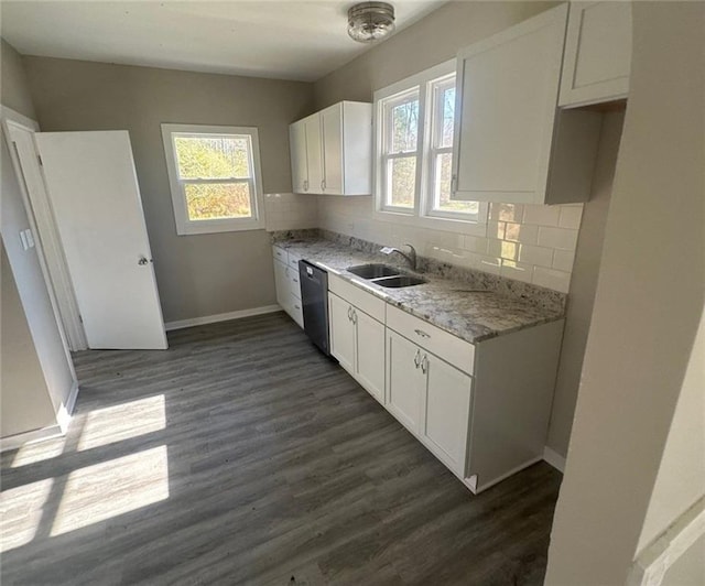 kitchen featuring white cabinets, sink, dark hardwood / wood-style floors, and light stone countertops