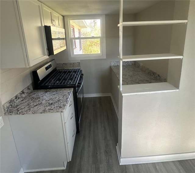 6970 Second St, Loretta, WI 54896 - kitchen featuring gas stove, dark wood-type flooring, white cabinetry, baseboards, and tasteful backsplash