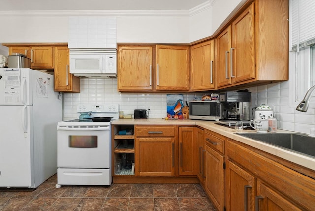 318 Mandt Pkwy, Stoughton, WI 53589 - kitchen with white appliances, brown cabinetry, ornamental molding, a sink, and decorative backsplash