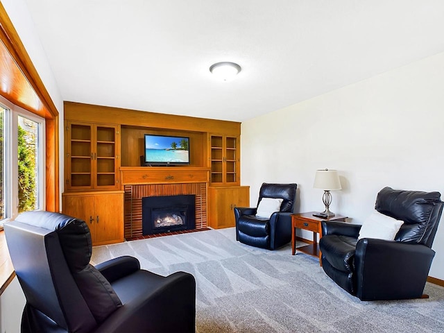 living room with light colored carpet and a fireplace