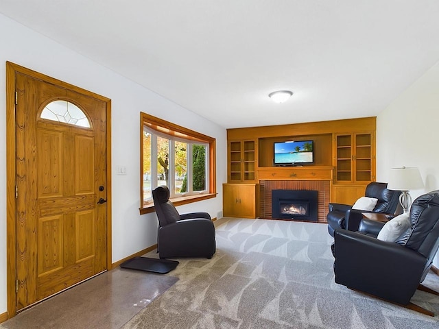 living room featuring carpet flooring and a brick fireplace