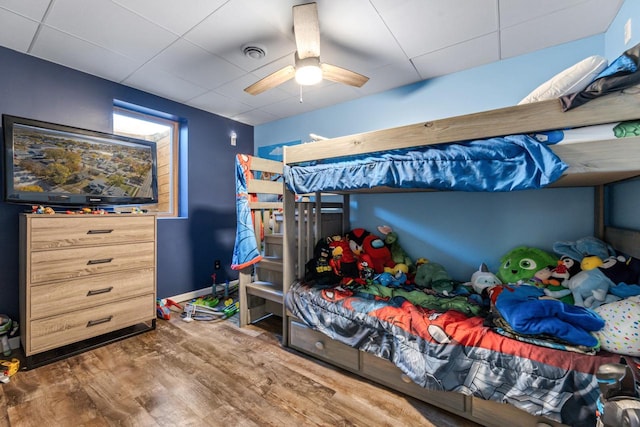 bedroom with wood-type flooring and ceiling fan