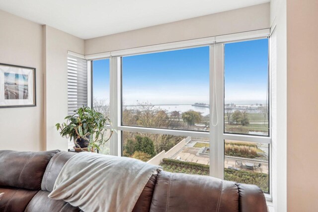 interior space featuring a wealth of natural light and a water view