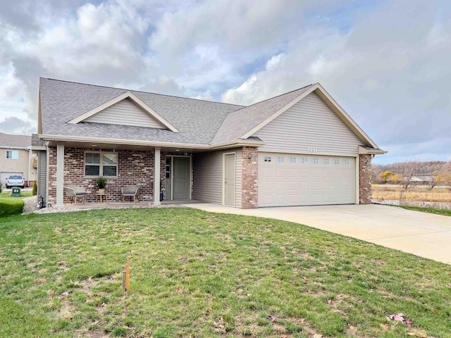 ranch-style home with a front yard and a garage