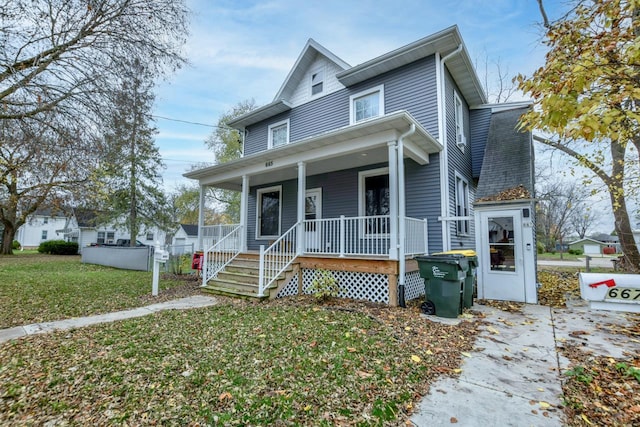 view of front facade with a front yard and a porch