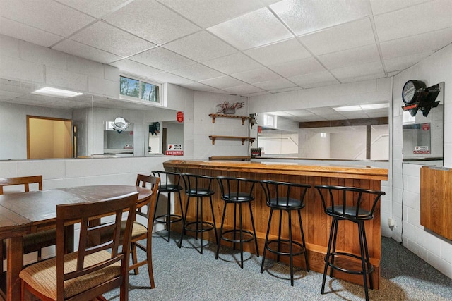 bar featuring a paneled ceiling