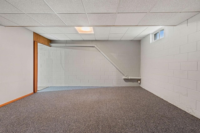 basement with a drop ceiling and carpet floors