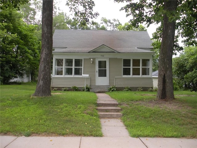 bungalow with a front lawn