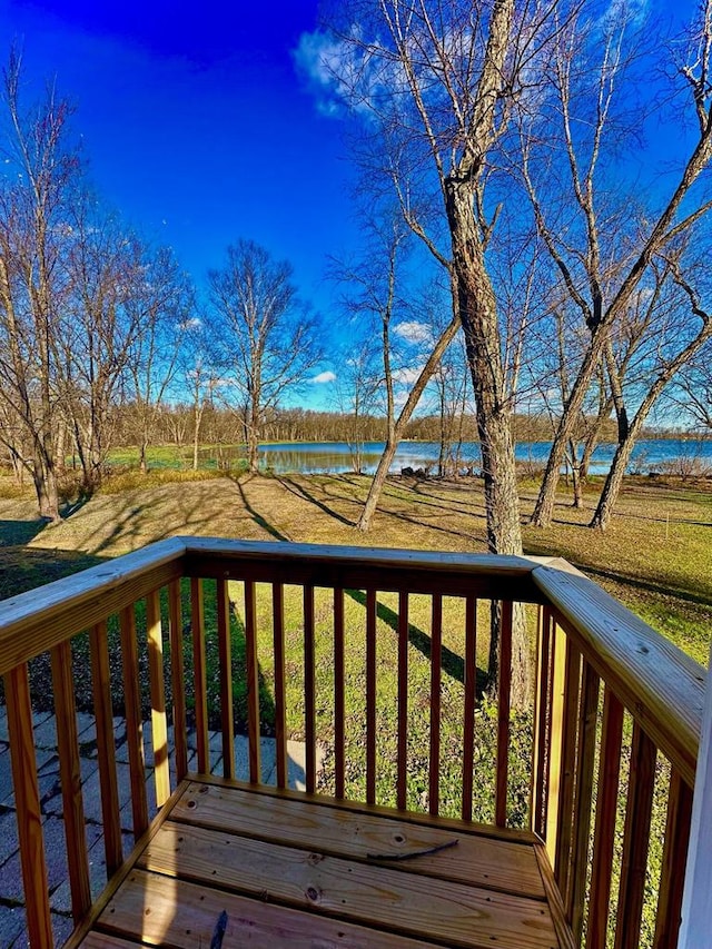 wooden deck featuring a water view