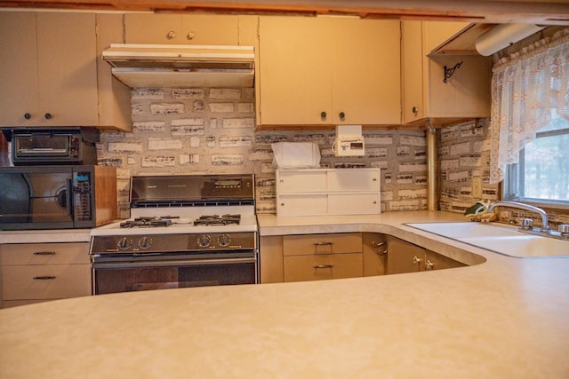 kitchen with range with gas cooktop and sink