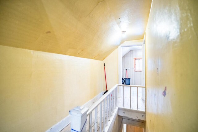 hallway featuring lofted ceiling