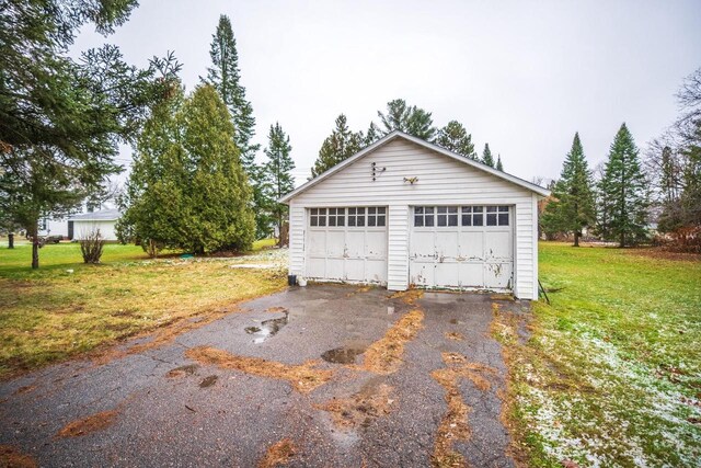 garage with a yard