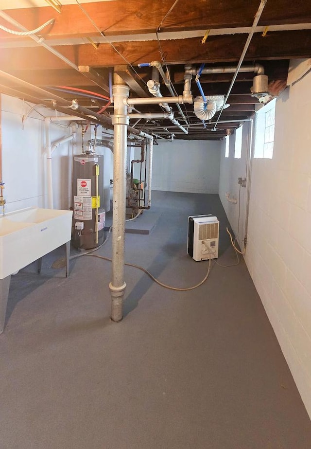 basement featuring heating unit and water heater