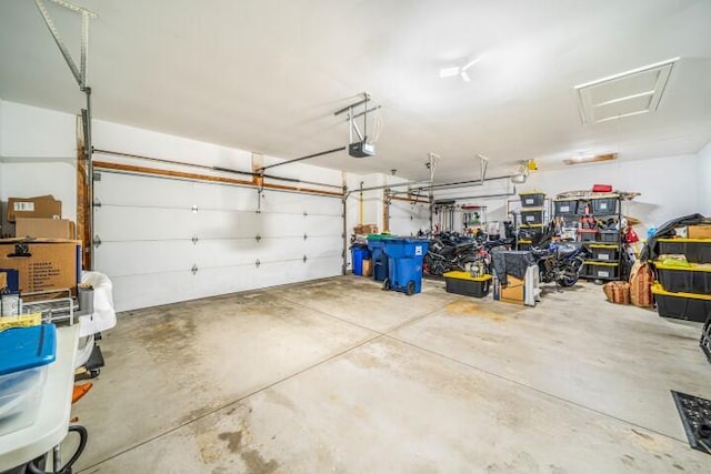 garage featuring a garage door opener