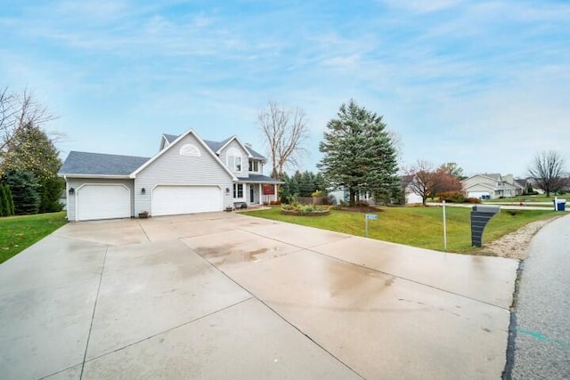 view of front of home with a garage and a front yard