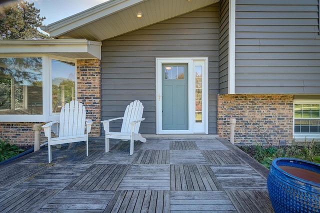 property entrance with a deck